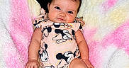 Harlie is registered to the contest to win money with this photo: baby, barefoot, blanket, child, clothing, cozy, cushion, cute, expression, face, hair, indoor, infant, minnie_mouse, onesie, person, pink, seat, smile, yellow
