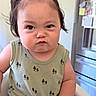 Nils joined the competition — help win amazing prizes! toddler, child, baby, high_chair, green_tank_top, tree_prints, hair_scrunchie, ponytail, indoor, kitchen, expression, face, person, sitting, cute, chubby, furniture, appliance, portrait, young_child