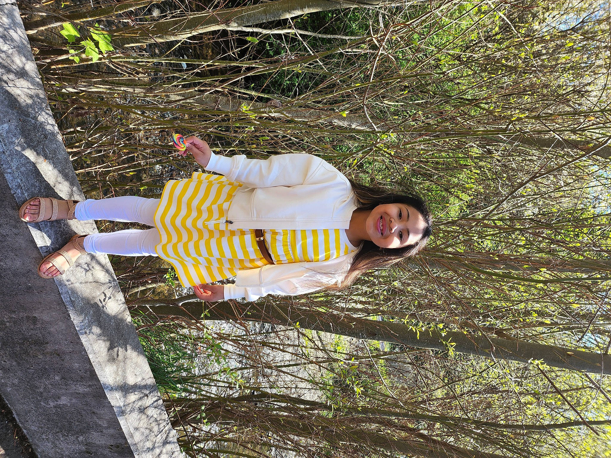 Katarina joined the competition — help win amazing prizes! child, fun, grass, groundcover, happy, joy, leisure, people_in_nature, person, plant, shadow, smile, toddler, tree, trunk, walking_shoe, wood