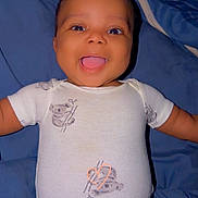Bryson joined the competition — help win amazing prizes! baby, smiling, onesie, koala_print, blue_blanket, happy, infant, cute, tongue_out, child, portrait, laying_down, soft_lighting, indoor, human, young, adorable, clothing, baby_girl, baby_boy