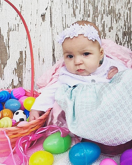 Laurel is registered to the contest to win money with this photo: baby, baby_playing_with_toys, baby_products, baby_toddler_clothing, baby_toys, child, easter, easter_egg, holiday, person, pink, play, toddler