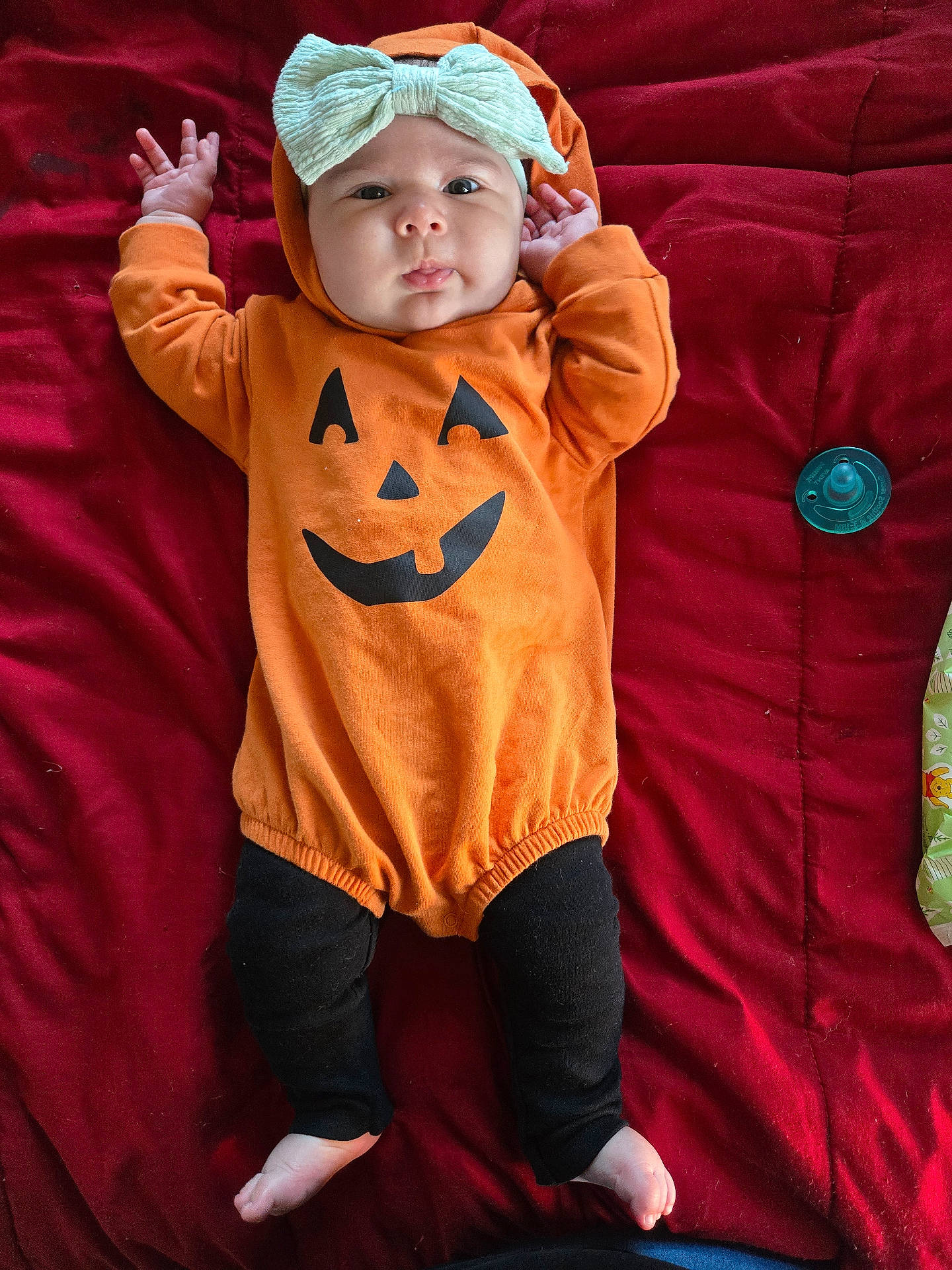 Brilynn joined the competition — help win amazing prizes! baby, bodypart, bonnet, cap, clothing, couch, face, finger, hand, hat, head, hood, hoodie, knitwear, pants, person, photography, portrait, sweater, sweatshirt