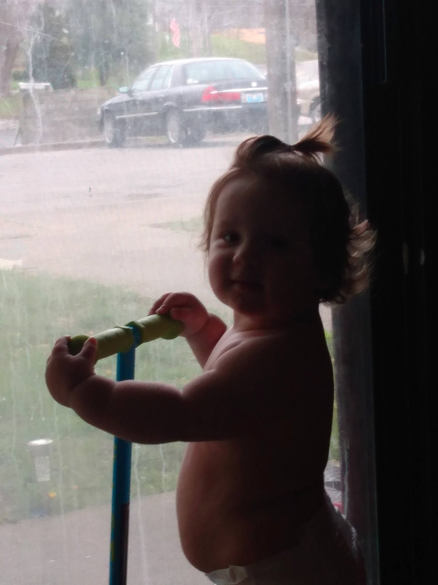 Danny is registered to the contest to win money with this photo: arm, automotive_lighting, car, child, flash_photography, fun, gesture, hand, happy, lip, morning, person, shoulder, standing, thumb, tire, toddler, tree, under_exposed, vehicle_door