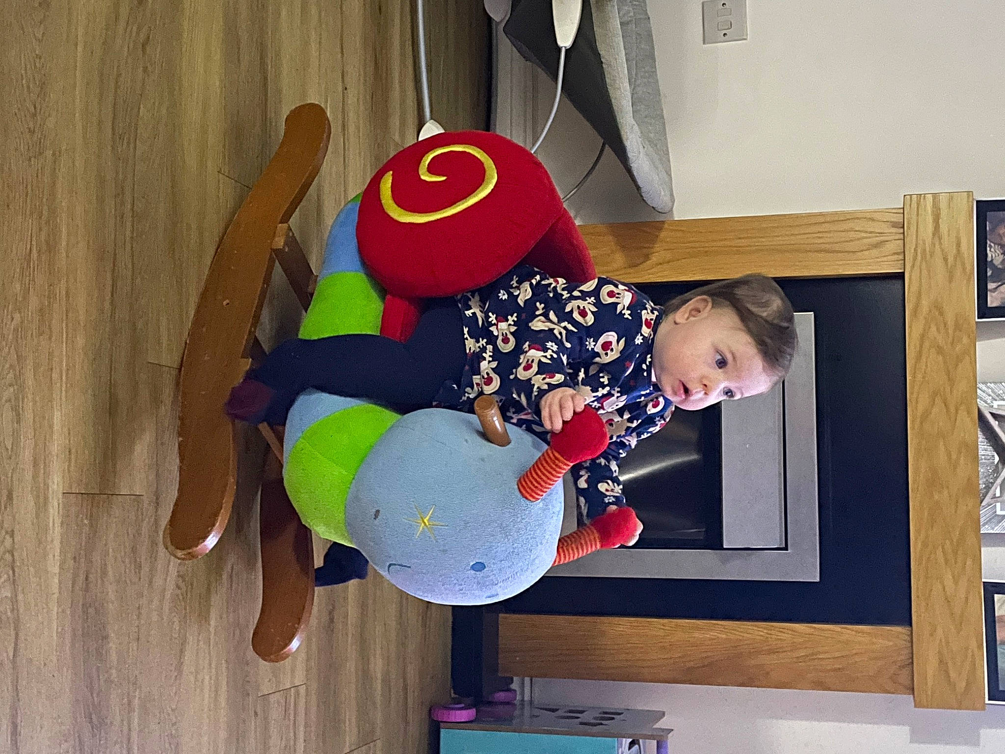 Fallon is registered to the contest to win money with this photo: art, child, cleanliness, comfort, flooring, hardwood, person, play, room, sleeve, surprise, t_shirt, toddler, wood