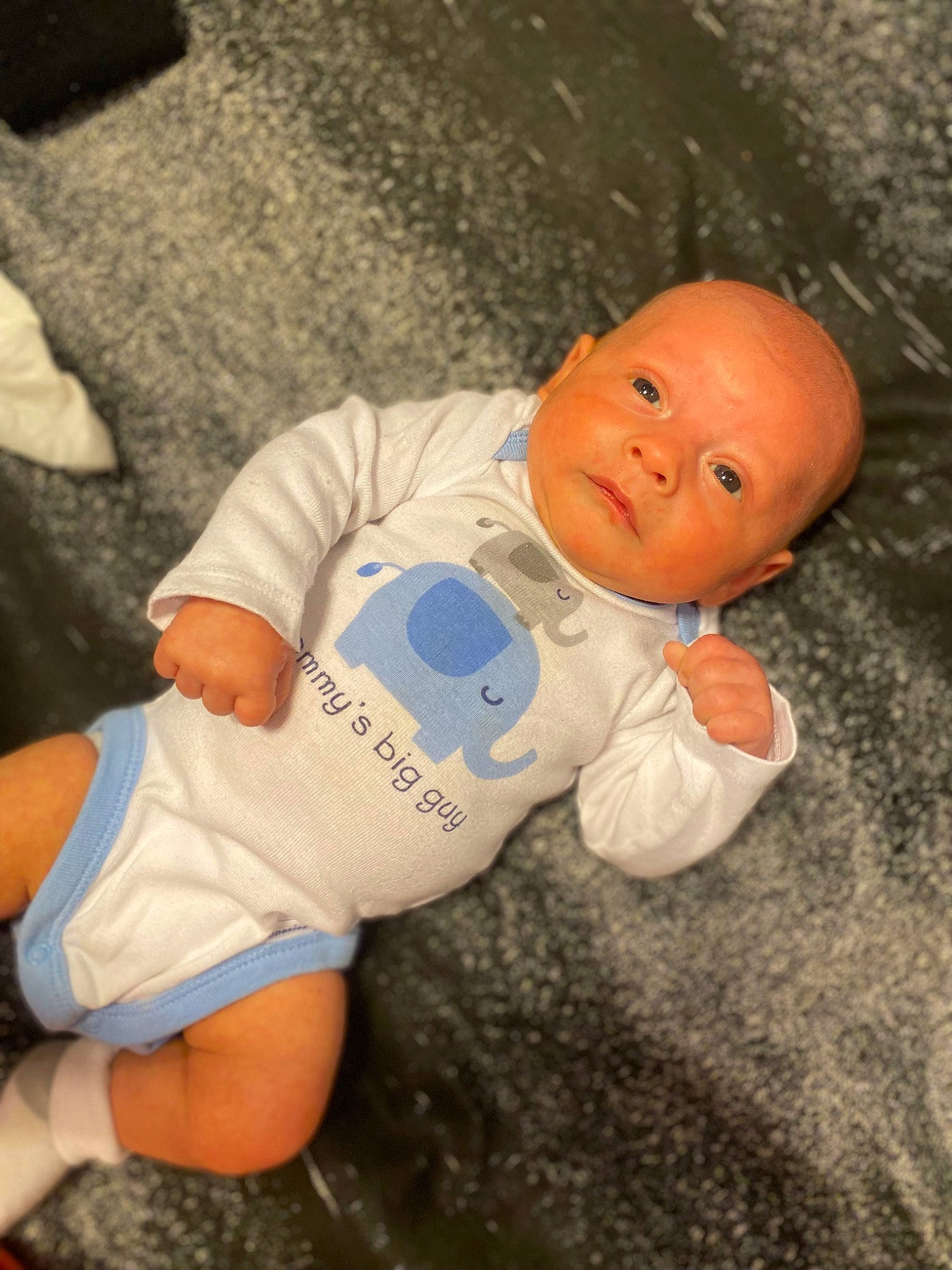 Tatum Ray is registered to the contest to win money with this photo: baby, baby_toddler_clothing, cheek, child, comfort, eye, face, fun, head, human_body, human_leg, infant_bodysuit, nose, person, sitting, skin, sleeve, stuffed_toy, thigh, toddler