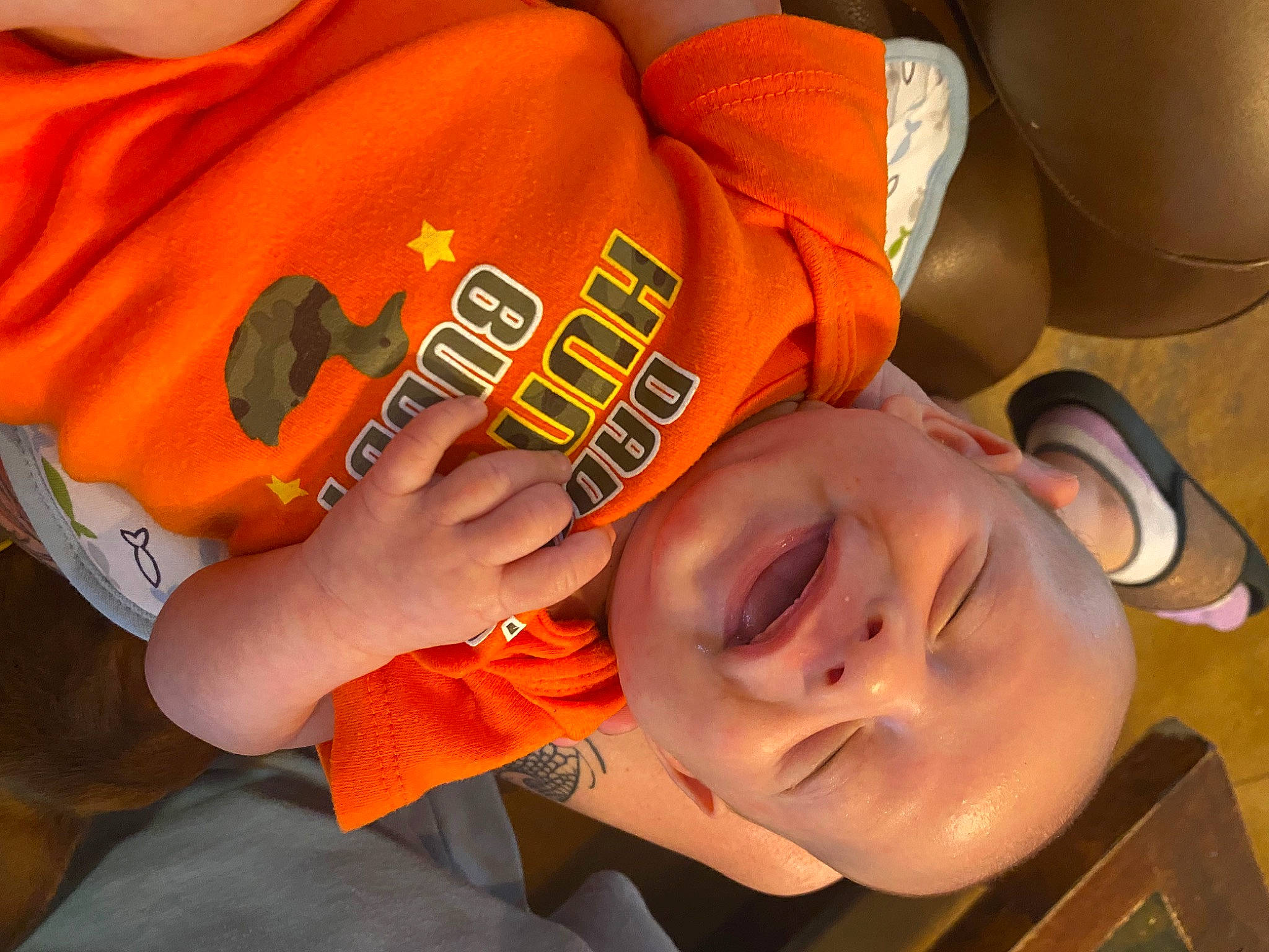 Tatum Ray is registered to the contest to win money with this photo: child, elbow, eyewear, finger, fun, gesture, hairstyle, hand, happy, human_body, mouth, nail, nose, orange, person, sleeve, smile, t_shirt, thumb, toddler