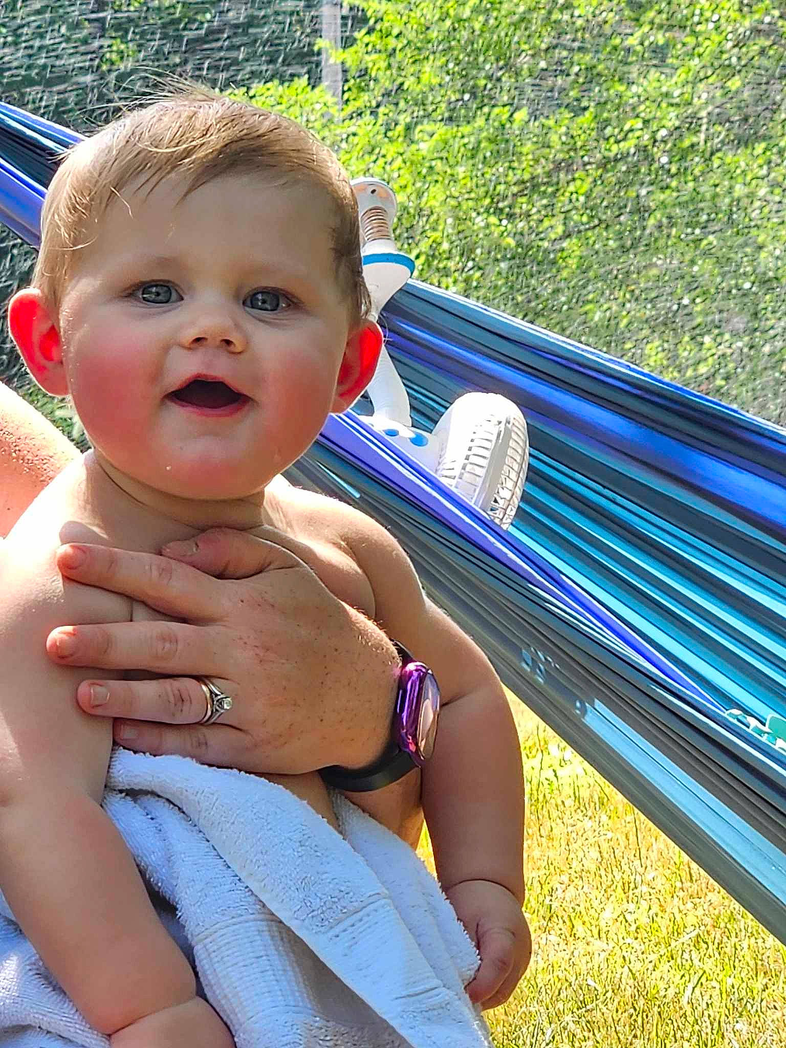 Aiden is registered to the contest to win money with this photo: baby, baby_toddler_clothing, cheek, chest, child, electric_blue, fun, gesture, grass, hand, happy, leisure, outdoor_furniture, person, recreation, skin, smile, summer, thumb, toddler