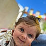 baby, child, smiling, face, blue_eyes, outdoor, blurred_background, cute, portrait, clothing, bunny_print, happy, infant, person, head, skin, hair, daylight, closeup, cheerful