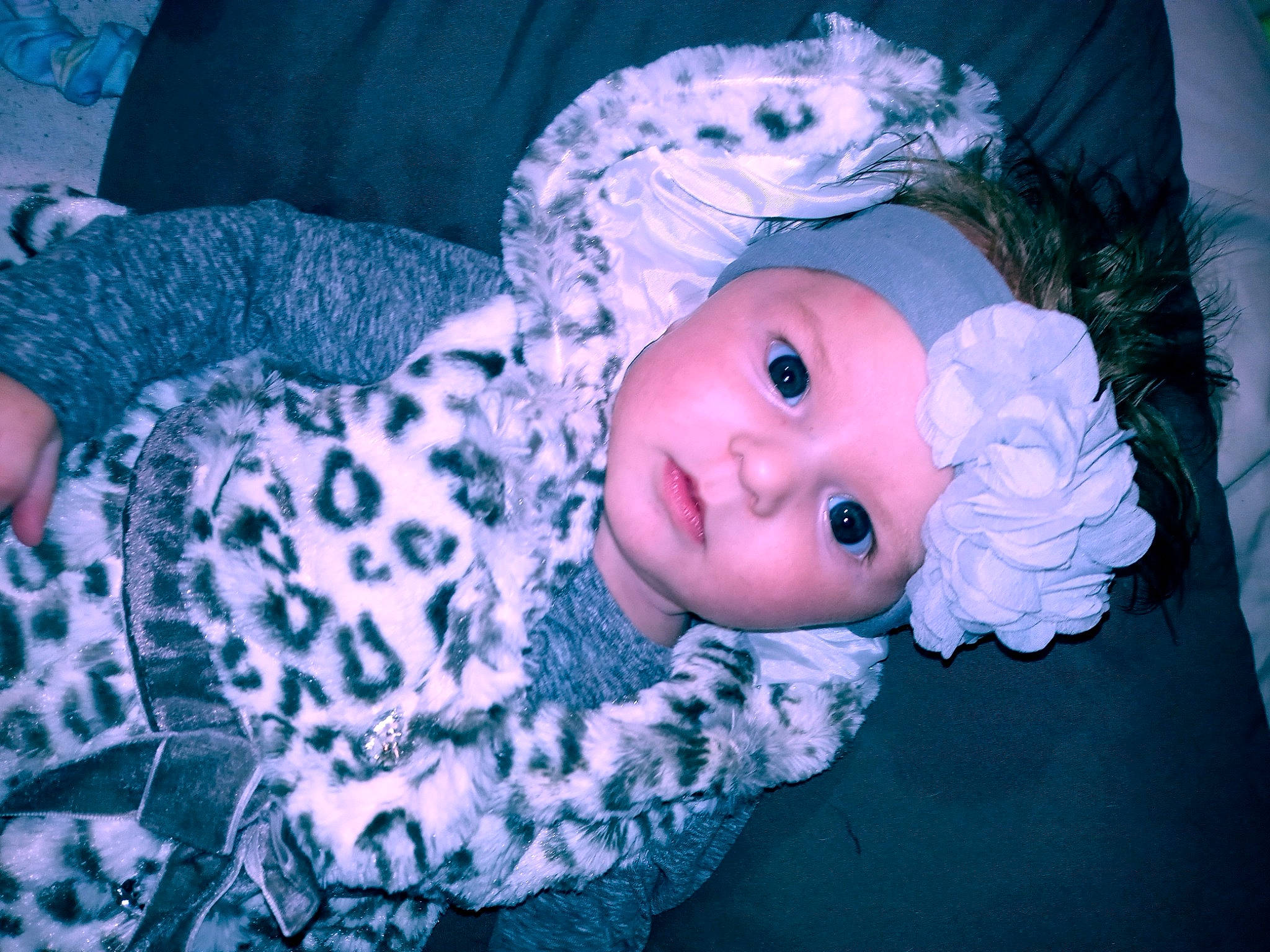 Emma is registered to the contest to win money with this photo: baby, blue, cheek, child, eye, head, headwear, iris, person, pink, skin, smile, toddler