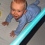 baby, blue_eyes, child, crawling, curious, fabric, face, floor, hand, head, indoor, infant, pajamas, plastic, playpen, smiling, soft_toy, toy, water_bottle, yellow_toy