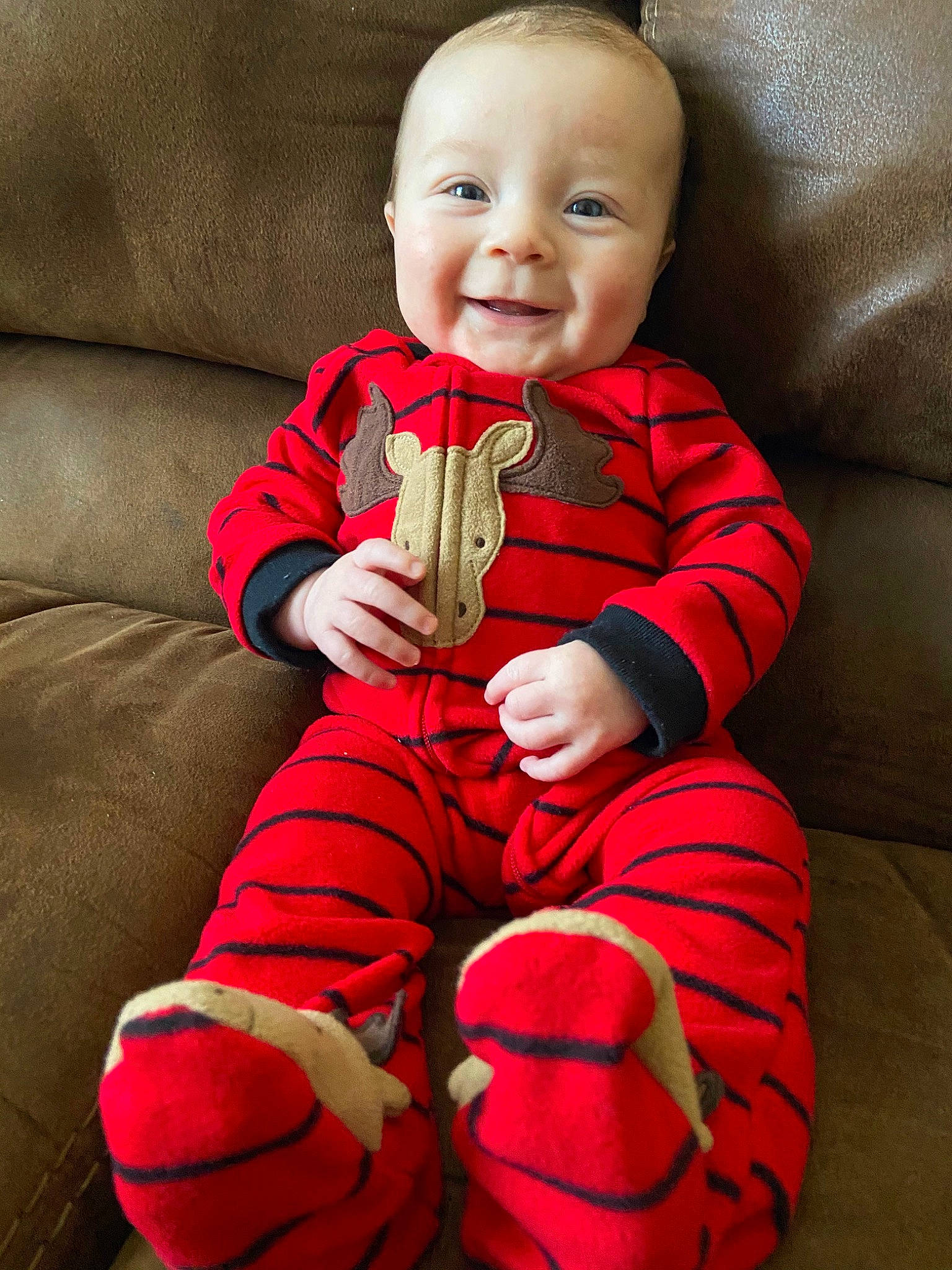 Jaxson joined the competition — help win amazing prizes! baby, baby_products, baby_toddler_clothing, child, finger, leg, person, product, red, sitting, toddler