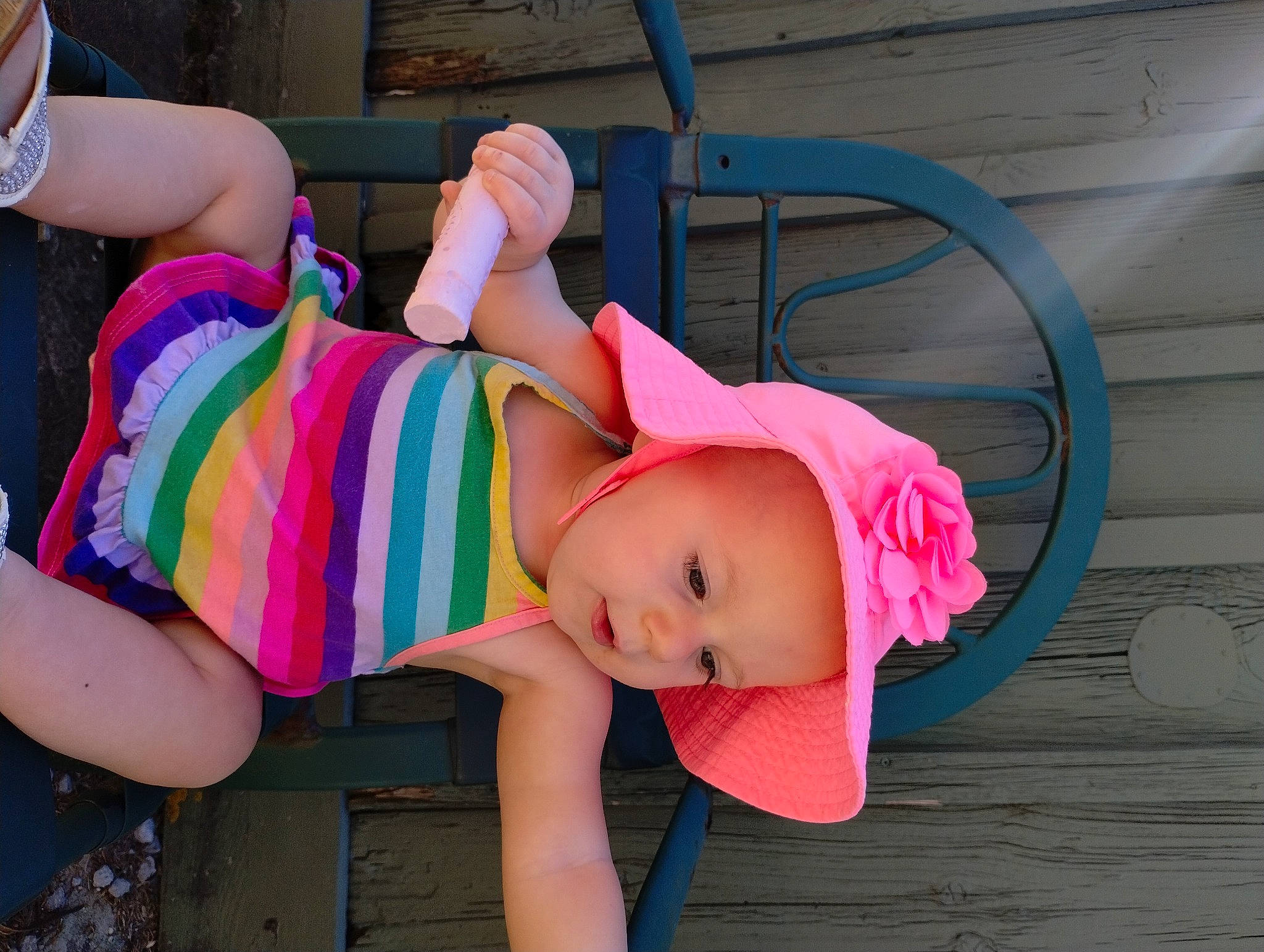 Rose Marie Hale is registered to the contest to win money with this photo: baby_toddler_clothing, child, dress, eyewear, fashion_accessory, fun, happy, hat, headwear, human_leg, leisure, magenta, person, pink, sandal, sitting, sun_hat, sunglasses, thigh, toddler
