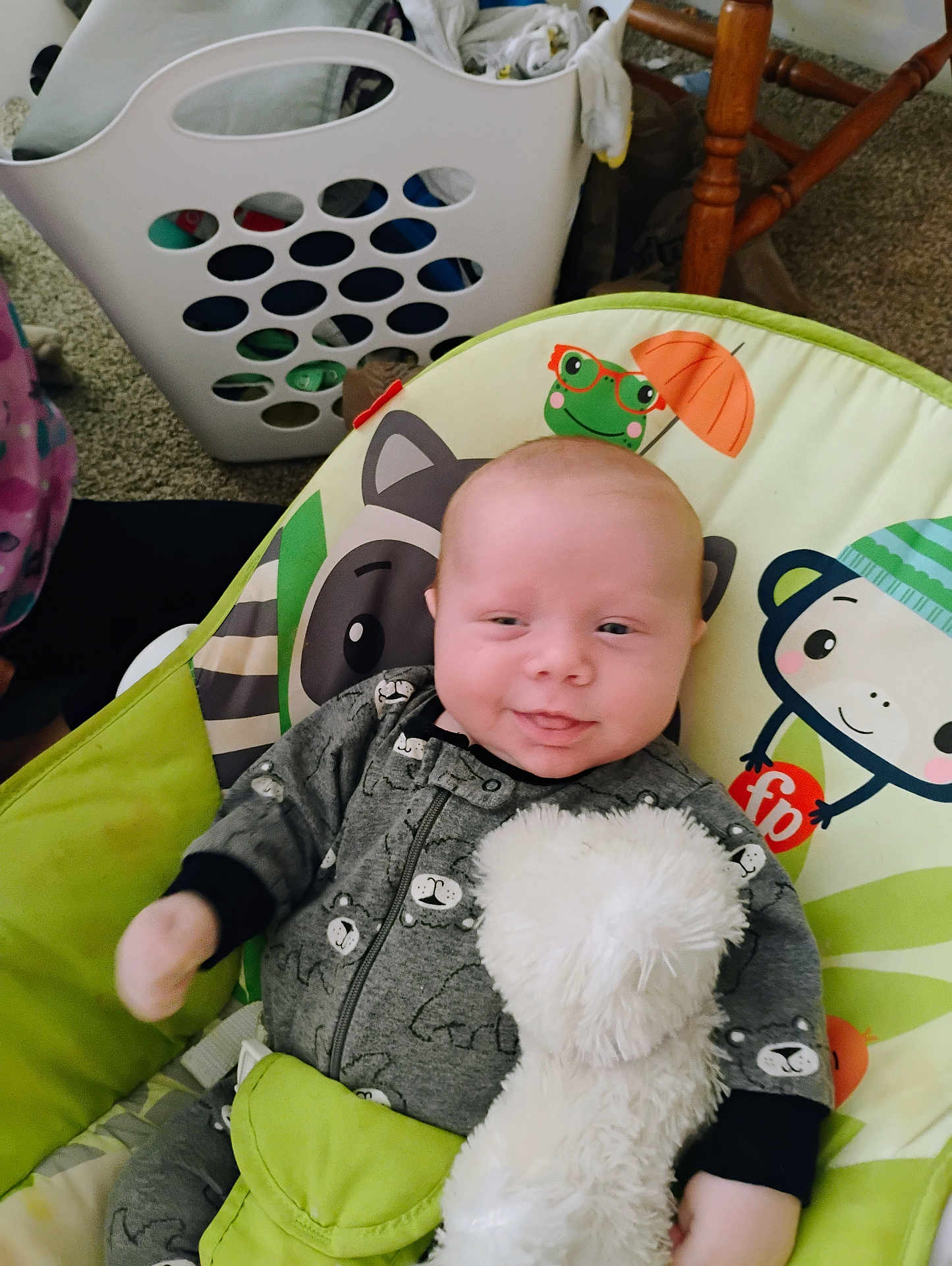 Marshall joined the competition — help win amazing prizes! baby, infant, smile, onesie, stuffed_toy, baby_seat, cartoon_animals, laundry_basket, carpet, furniture, wooden_chair, indoor, cute, child, soft_toy, clothing, happy, toddler, seat, home