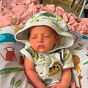 Axel joined the competition — help win amazing prizes! baby, sleeping, hoodie, onesie, pillow, animal_print, pink_blanket, infant, cute, child, cozy, bedroom, furniture, soft, hands, peaceful, portrait, indoors, rest, newborn