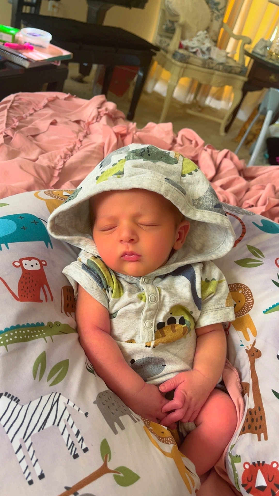 Axel joined the competition — help win amazing prizes! baby, sleeping, hoodie, onesie, pillow, animal_print, pink_blanket, infant, cute, child, cozy, bedroom, furniture, soft, hands, peaceful, portrait, indoors, rest, newborn