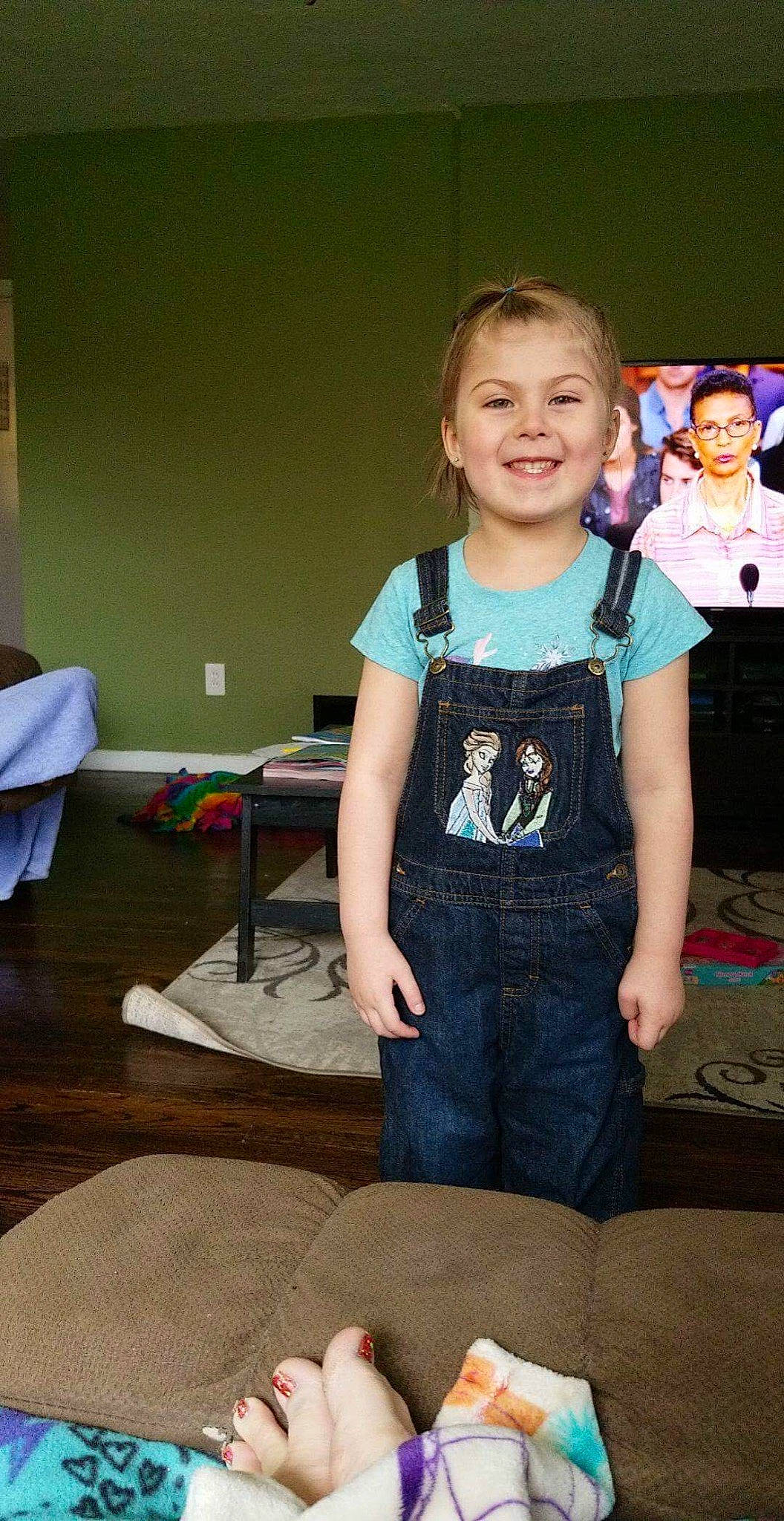 Riley is registered to the contest to win money with this photo: child, joy, person, play, sitting, smile, standing, t_shirt, toddler