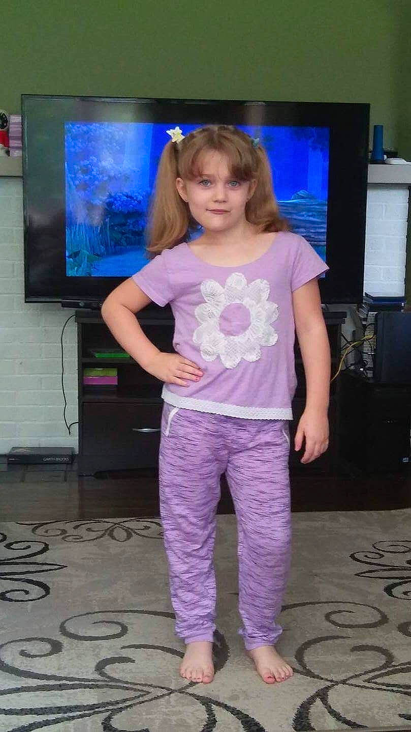 Cassie joined the competition — help win amazing prizes! child, child_model, electronic_device, leggings, pajamas, person, purple, shoulder, standing, t_shirt, technology, trousers, violet