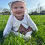 baby, infant, smile, hat, grass, outdoors, sunlight, blue_sky, cardigan, floral_dress, drool, cheeks, sitting, portrait, green_grass, fence, closeup, happy, nature, toddler