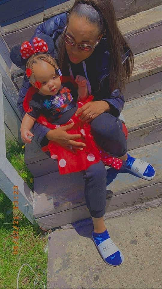 Kamaria is registered to the contest to win money with this photo: baby, baby_toddler_clothing, blue, boot, child, electric_blue, face, fun, glasses, grass, happy, lap, leisure, person, plant, recreation, red, shoe, sitting, sneakers