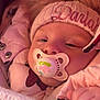 baby, pacifier, hat, pink_jacket, blanket, sleepy, cozy, child, face, hand, winter_clothing, fur_trim, closeup, infant, cute, warm, soft, portrait, snug, young_child