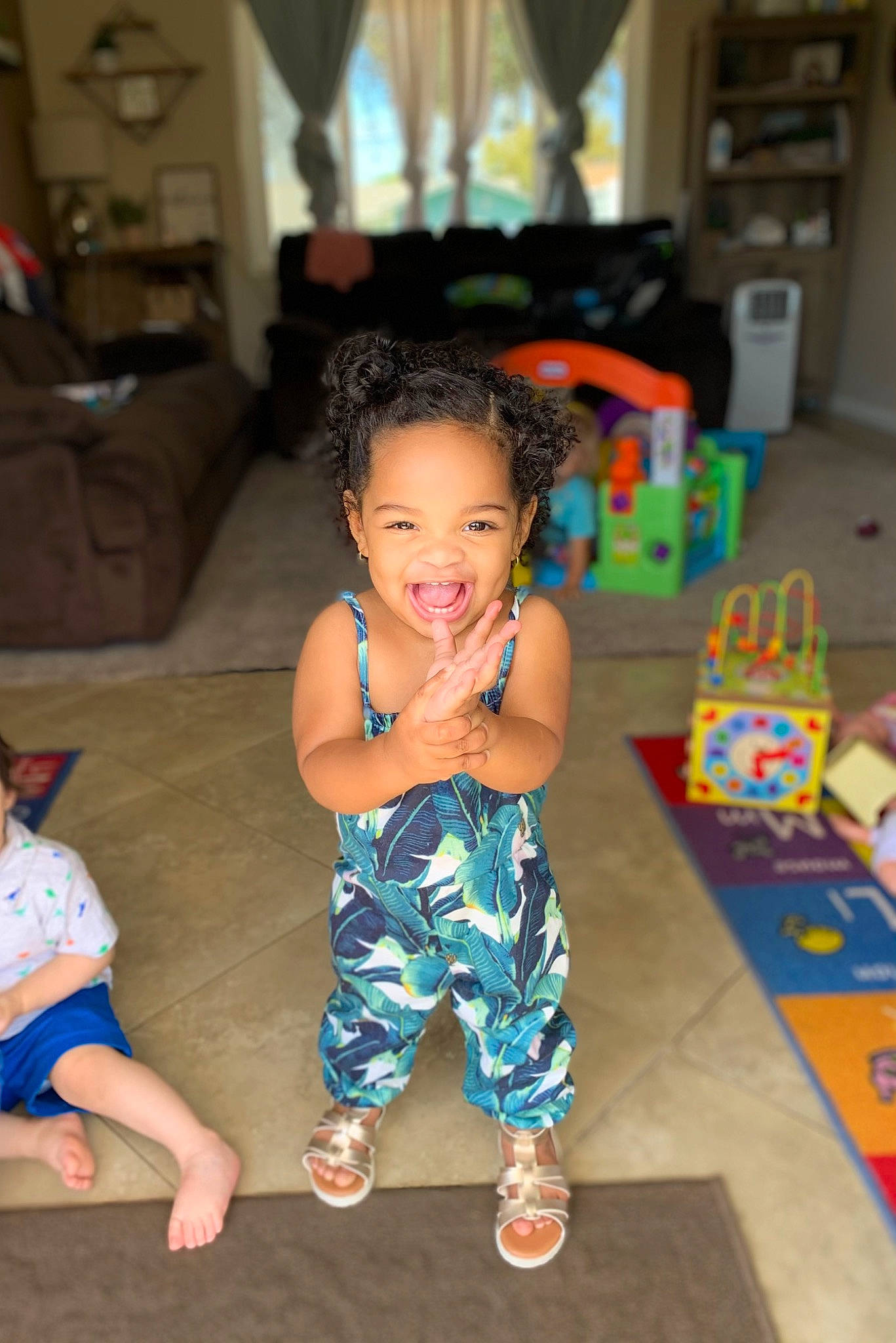 Renee joined the competition — help win amazing prizes! baby_toddler_clothing, barefoot, black_hair, child, event, face, floor, flooring, foot, fun, happy, iris, leisure, person, skin, smile, standing, summer, thigh, toddler