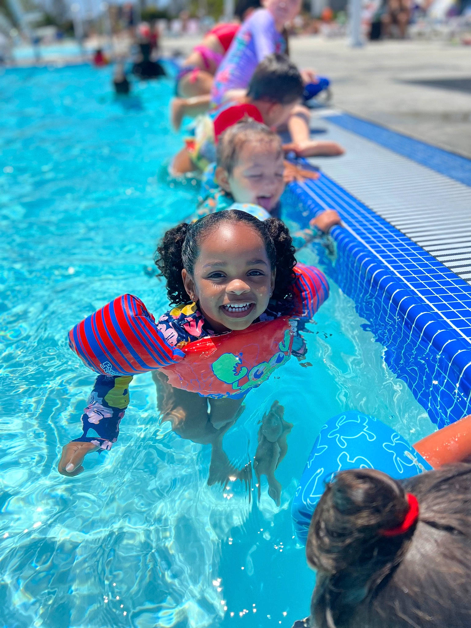 Renee joined the competition — help win amazing prizes! aqua, azure, blue, child, event, fun, happy, joy, leisure, nonbuilding_structure, outdoor_recreation, person, personal_protective_equipment, play, recreation, red, smile, summer, swimming_pool, toddler