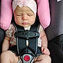 baby, infant, sleeping, car_seat, headband, flower, pink, straps, safety, child, cute, peaceful, clothing, seatbelt, closeup, small_hands, legs, soft_pillow, transportation, resting