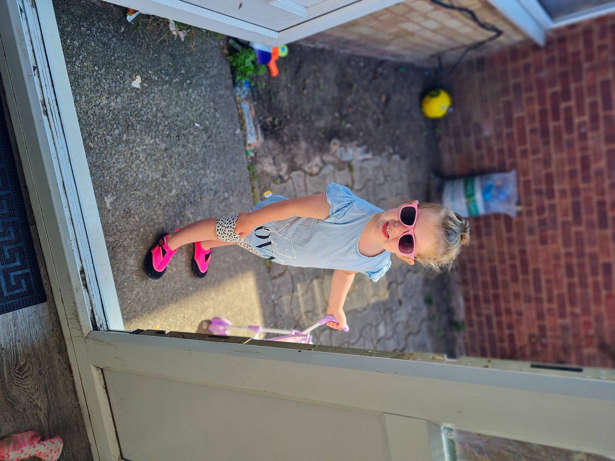 Maisy is registered to the contest to win money with this photo: adventure, brickwork, ceiling, concrete, elbow, floor, flooring, fun, hardwood, leisure, outdoor_shoe, person, recreation, room, shorts, t_shirt, toddler, walking_shoe, wall, wood