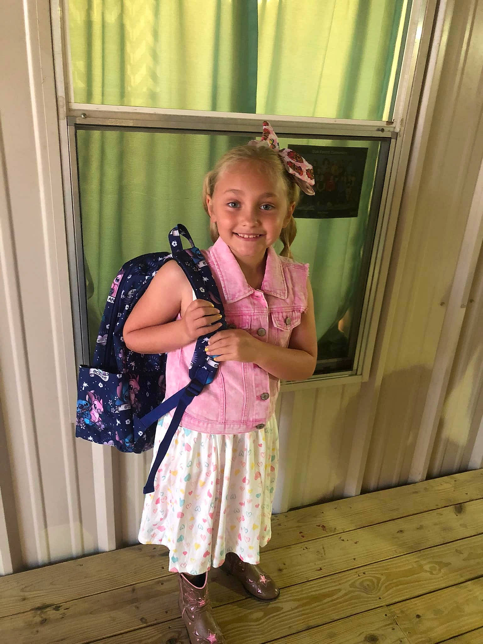Laylah is registered to the contest to win money with this photo: baby_toddler_clothing, bag, clothing, curtain, door, dress, fashion_design, fawn, happy, joy, leg, luggage_and_bags, magenta, person, pink, purple, sandal, shoe, shoulder, smile