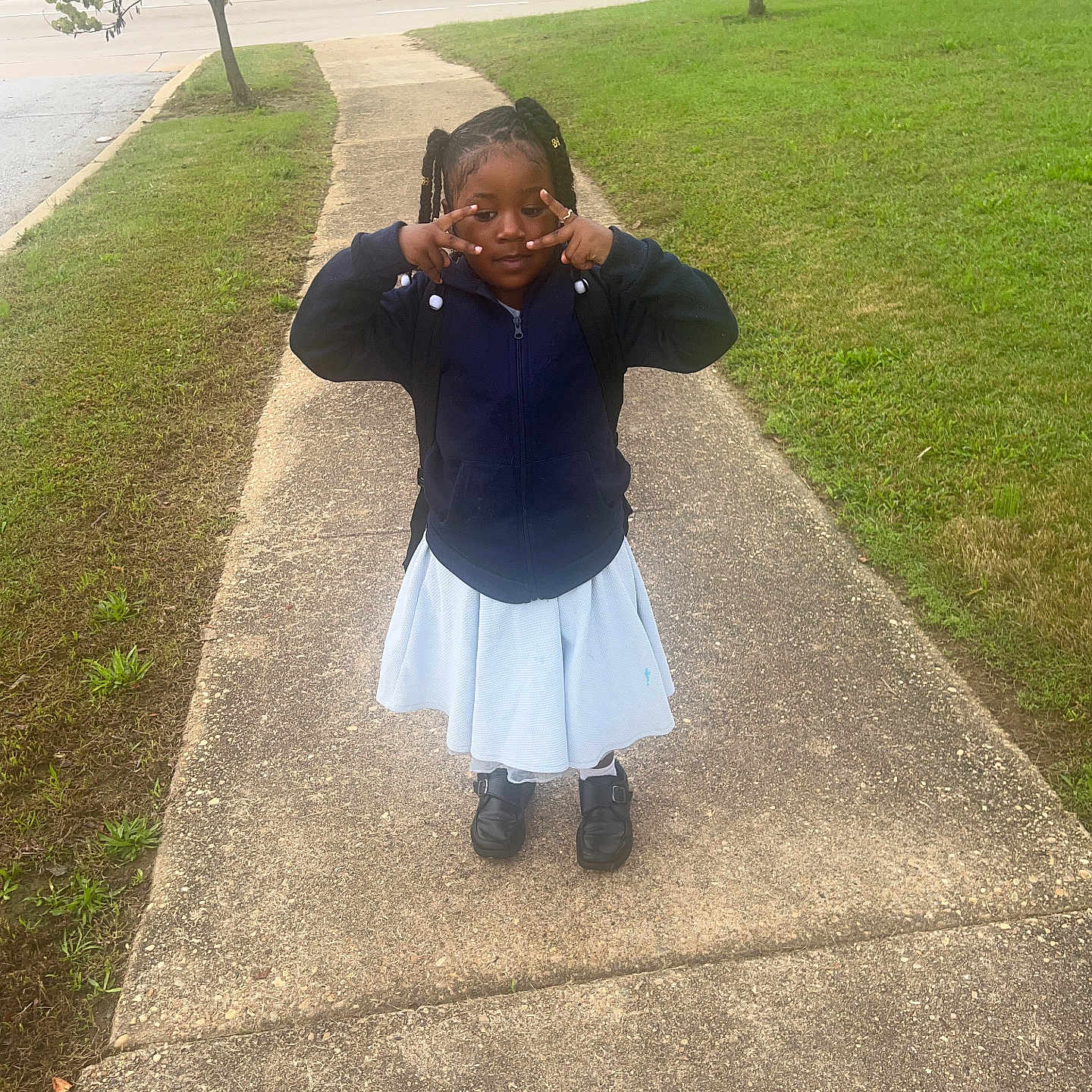 Raelynn is registered to the contest to win money with this photo: child, city, clothing, dress, face, grass, head, nature, outdoors, park, path, person, photography, plant, portrait, road, sidewalk, skirt, street, urban