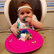 Emilee is registered to the contest to win money with this photo: baby, birthdaycake, bodypart, cake, cream, cupcake, cutlery, dessert, dish, face, finger, food, fork, hand, head, icing, meal, person, plate, sweets