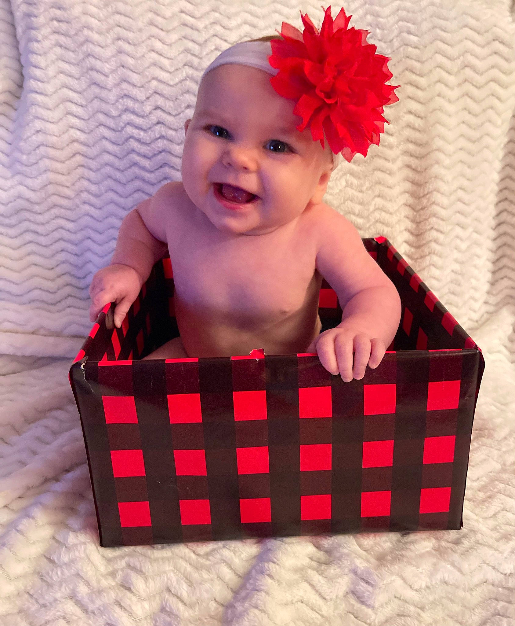 Kinslei is registered to the contest to win money with this photo: baby, baby_products, baby_toddler_clothing, basket, box, costume_hat, fashion_accessory, flower, happy, headband, headpiece, headwear, joy, magenta, pattern, person, pink, product, rectangle, red
