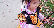 Myra is registered to the contest to win money with this photo: accessories, bag, child, clothing, coat, costume, face, female, footwear, girl, grass, handbag, hat, head, person, photography, plant, portrait, shoe, sunhat