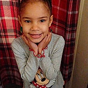 Myra joined the competition — help win amazing prizes! child, girl, smiling, pigtails, minnie_mouse, clothing, plaid_background, indoor, cute, happy, portrait, posing, long_sleeve, patterned_pants, youth, person, fashion, red, gray, casual