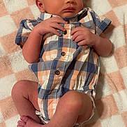 Emmanuel joined the competition — help win amazing prizes! baby, newborn, sleeping, plaid, romper, blanket, soft, infant, cute, peaceful, hands, feet, skin, child, portrait, indoors, rest, comfortable, clothing, young