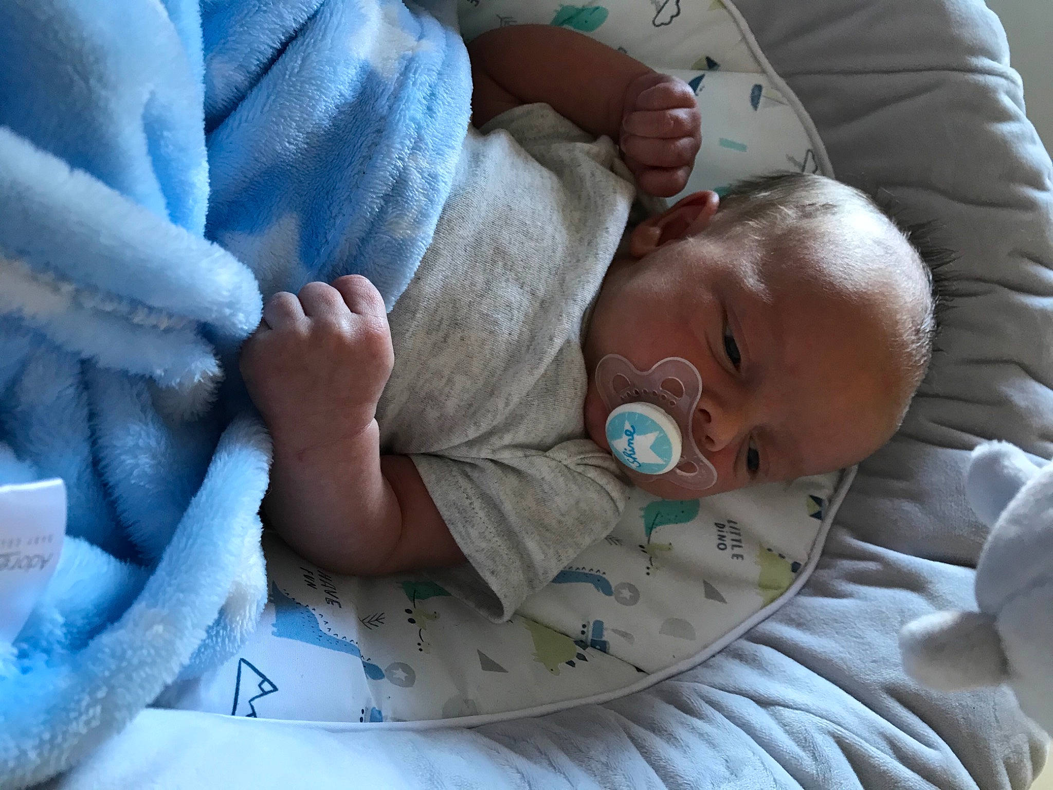 Conner is registered to the contest to win money with this photo: baby, baby_products, baby_toddler_clothing, bedtime, child, comfort, eye, face, facial_expression, finger, gesture, hand, head, human_body, linens, people, person, product, skin, toddler