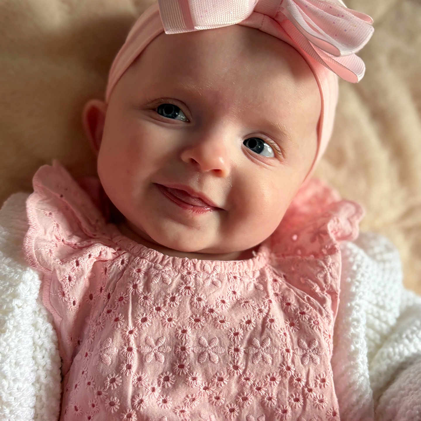 Iris is registered to the contest to win money with this photo: accessories, baby, bodypart, bonnet, cap, clothing, dress, face, finger, formalwear, hand, happy, hat, head, headband, newborn, person, photography, portrait, smile