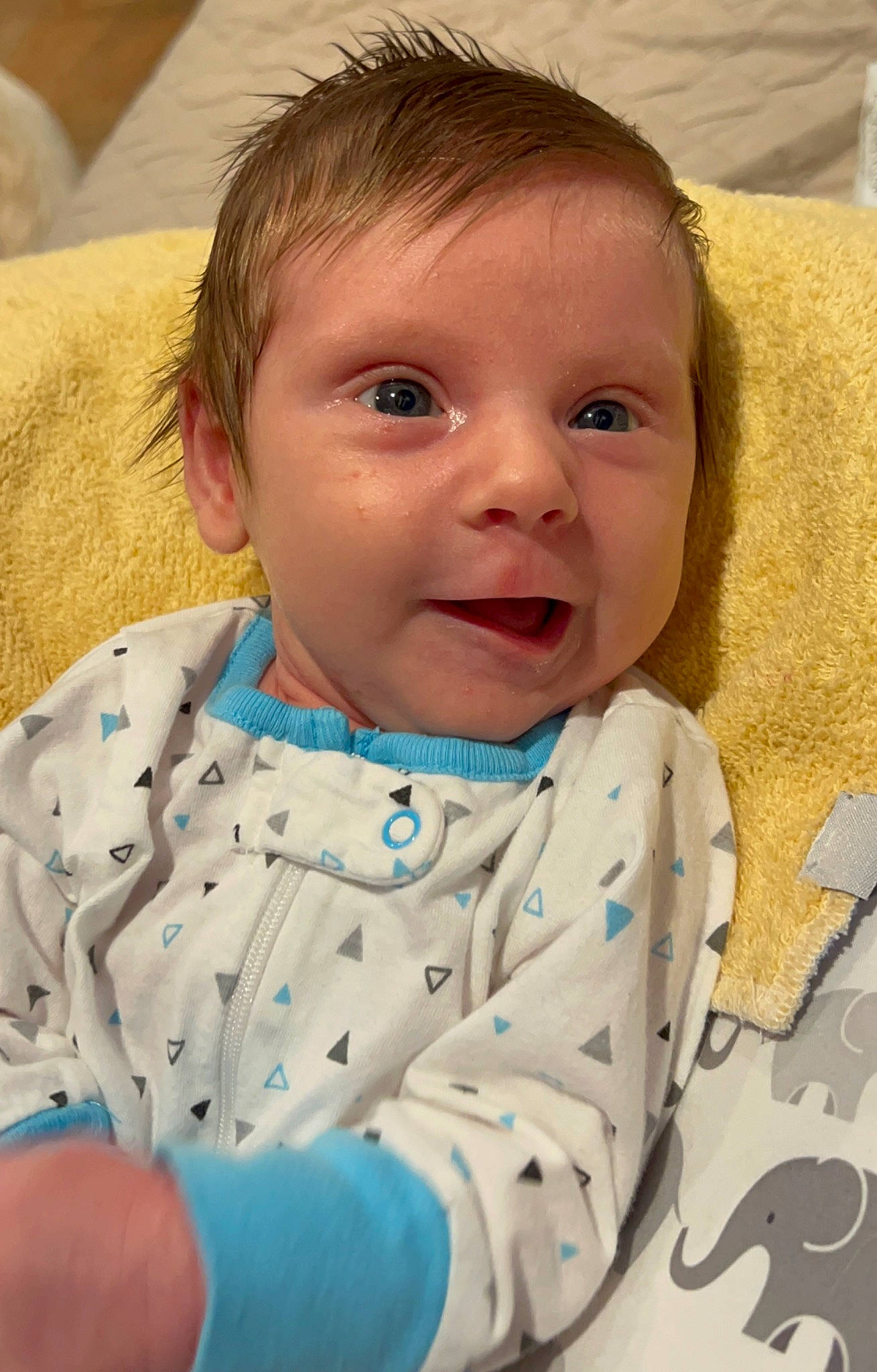 Malcolm is registered to the contest to win money with this photo: baby, baby_toddler_clothing, cheek, chin, comfort, eye, eyebrow, face, finger, happy, iris, lip, mammal, nose, organ, person, product, skin, sleeve, textile