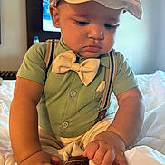 Hazen joined the competition — help win amazing prizes! toddler, child, baby, boy, hat, bow_tie, suspenders, shirt, shoes, bed, indoor, hands, face, curious, clothing, portrait, person, cute, fashion, furniture
