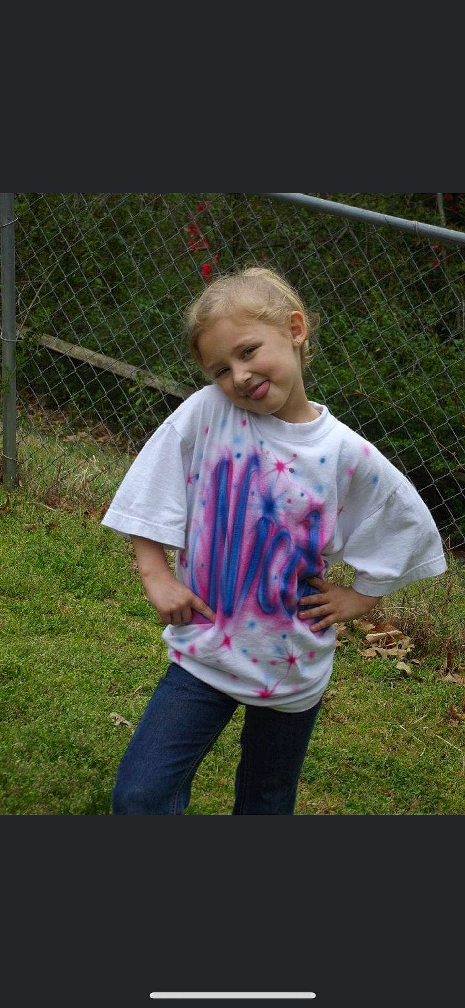 Skylar joined the competition — help win amazing prizes! child, face, facial_expression, fence, fun, grass, hair, hairstyle, happy, head, joy, lawn, mesh, net, pattern, people_in_nature, person, recreation, sleeve, smile