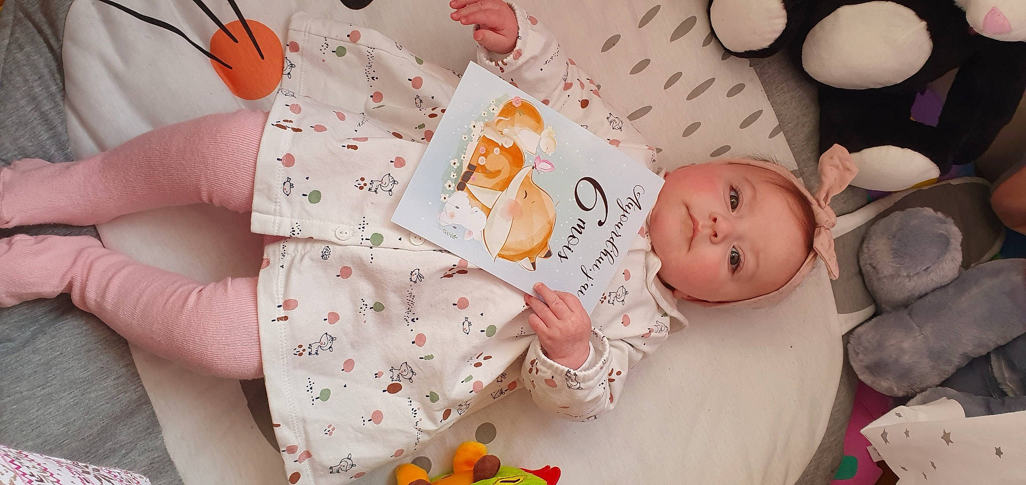 Enola participe au concours pour gagner de l'argent avec cette photo : arm, baby, baby_products, baby_sleeping, baby_toddler_clothing, cheek, child, comfort, event, finger, happy, linens, orange, person, pink, product, room, skin, textile, toddler