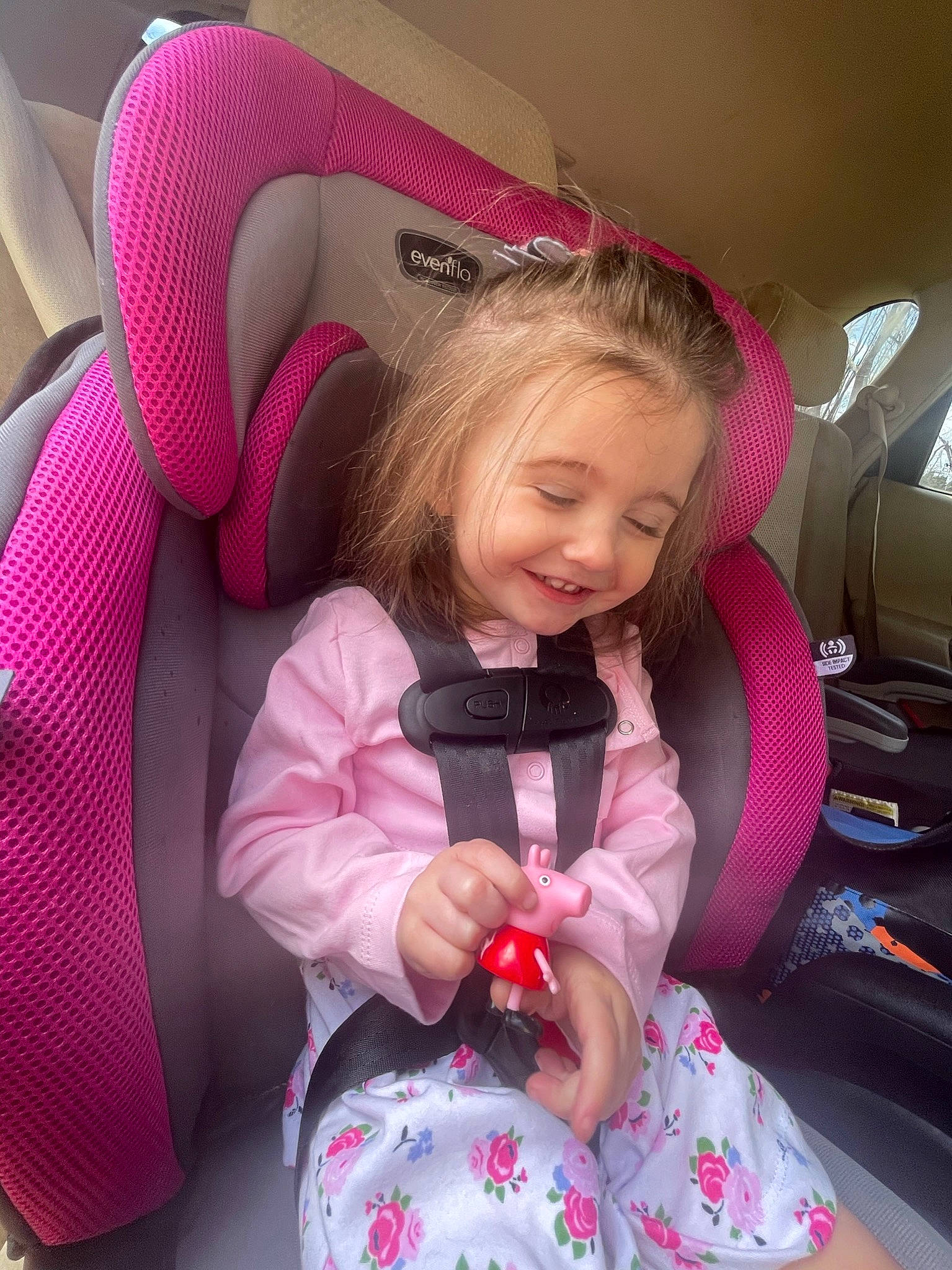 Leona is registered to the contest to win money with this photo: baby_carriage, baby_in_car_seat, baby_products, baby_toddler_clothing, car_seat, car_seat_cover, child, comfort, cool, finger, fun, happy, human_body, joy, lap, magenta, mouth, person, pink, purple