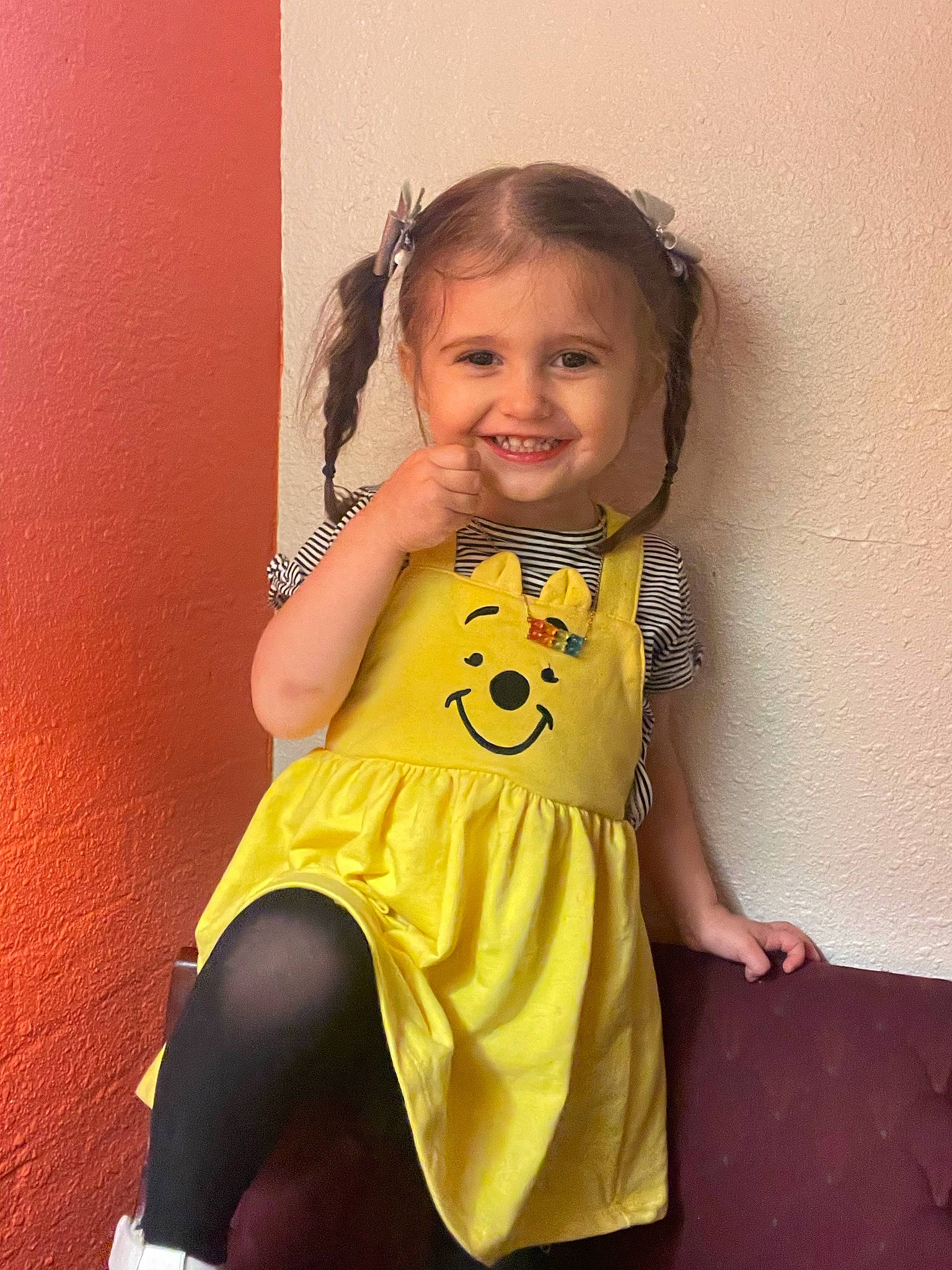 Leona is registered to the contest to win money with this photo: arm, baby_toddler_clothing, chin, clothing, dress, flash_photography, fun, happy, iris, joy, leg, neck, one_piece_garment, person, shoulder, sleeve, smile, standing, thigh, toddler