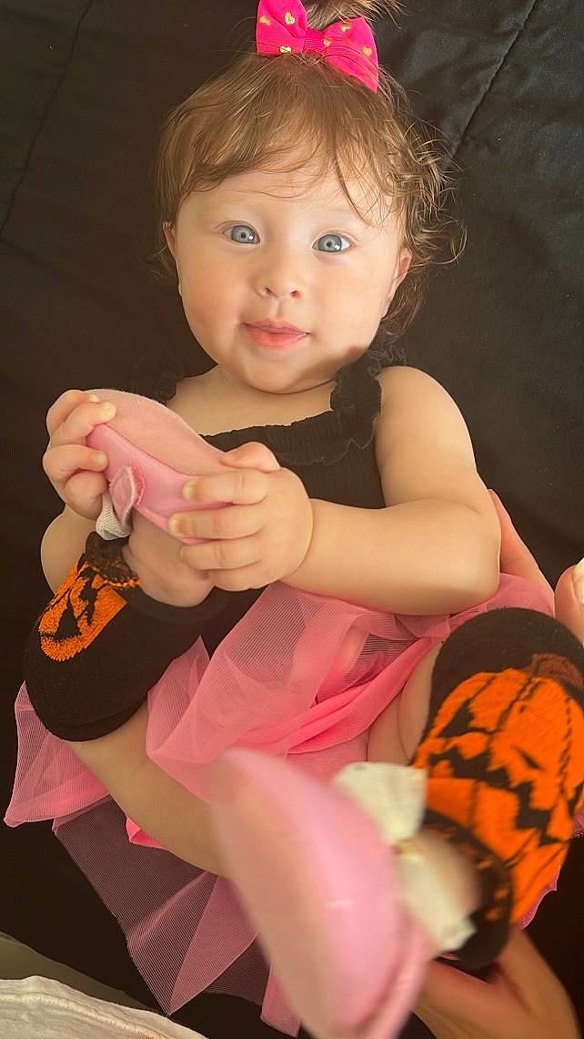 Ariana joined the competition — help win amazing prizes! arm, baby, baby_toddler_clothing, beauty, cheek, child, facial_expression, finger, fun, gesture, hand, happy, human_leg, nail, person, pink, skin, sock, thigh, thumb
