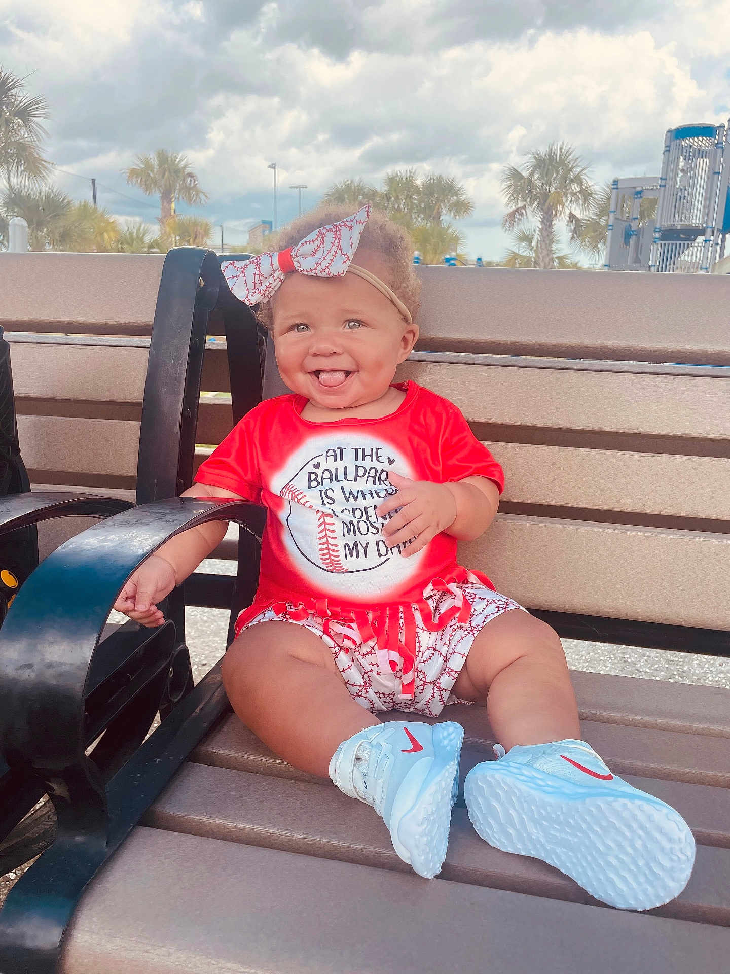 Savannah joined the competition — help win amazing prizes! baby, baseballcap, clothing, face, footwear, grass, head, nature, outdoors, park, person, photography, plant, portrait, shoe, shorts, sitting, summer, t_shirt, tree