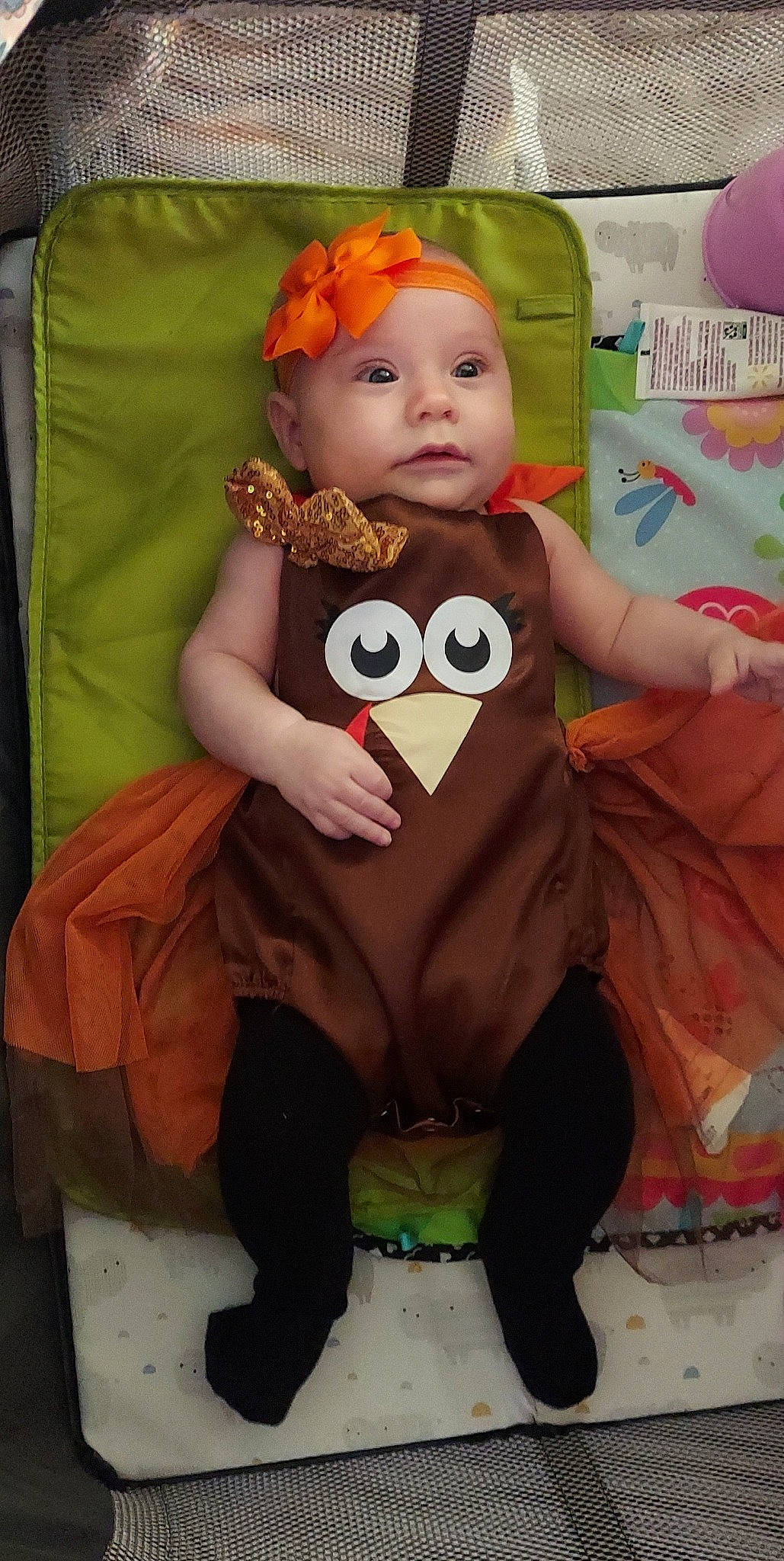 Erelah is registered to the contest to win money with this photo: baby, baby_toddler_clothing, cheek, child, costume, doll, eye, happy, head, headwear, orange, person, pink, plush, room, sitting, skin, sleeve, stuffed_toy, textile