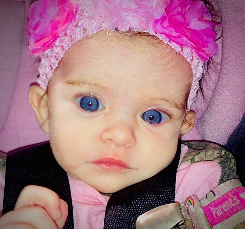 Beverly is registered to the contest to win money with this photo: cheek, chin, dress, ear, eyebrow, eyelash, hairstyle, hand, human, iris, lip, nose, organ, outerwear, person, photograph, product, purple, skin, sleeve