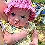 Delia joined the competition — help win amazing prizes! baby, pink_hat, dress, outdoor, child, person, summer, park, sunlight, closeup, face, blue_eyes, hand, nature, grass, blurred_background, people, sitting, holding, cute