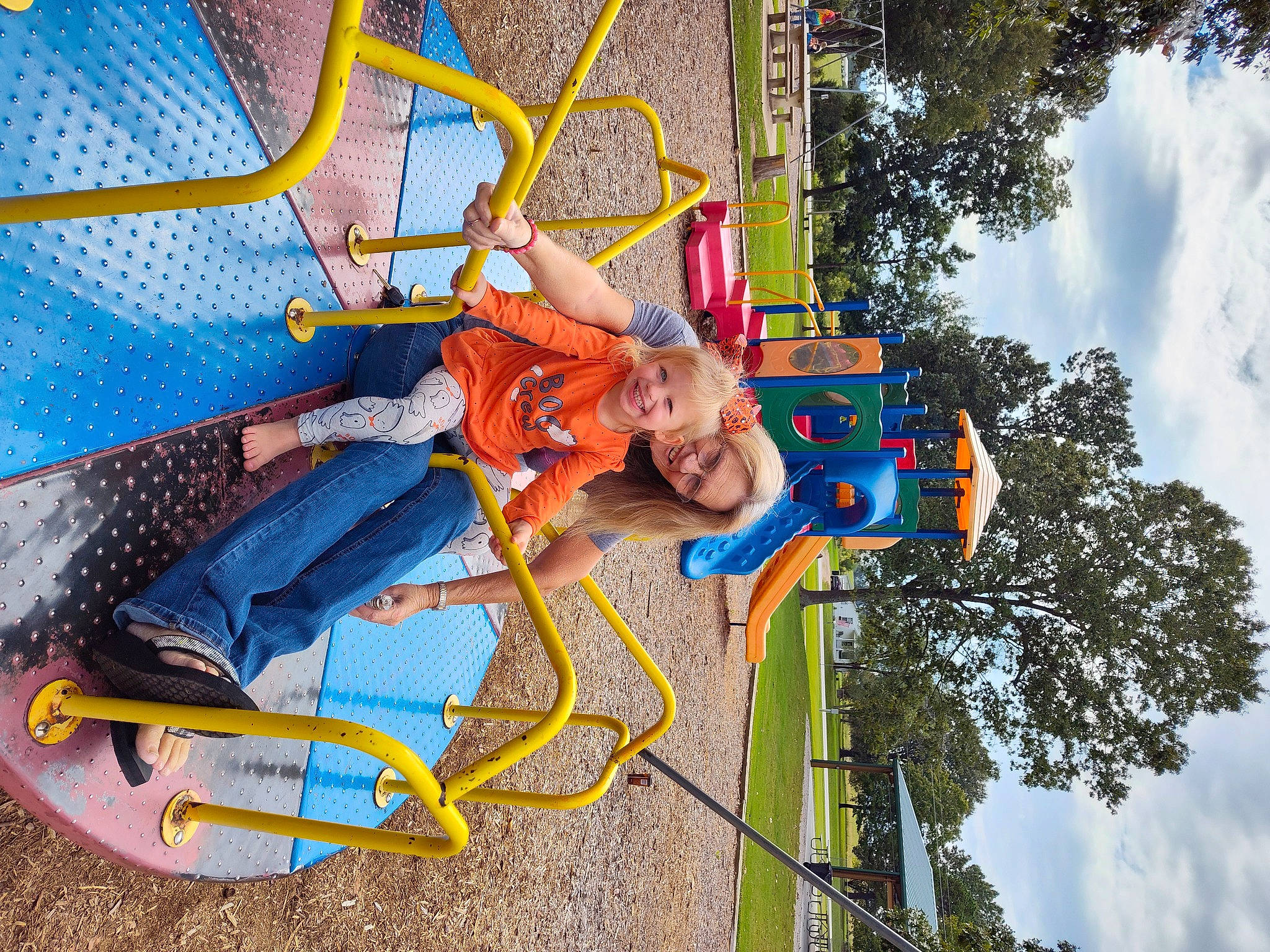 Hazelbelle is registered to the contest to win money with this photo: amusement_ride, child, city, cloud, electric_blue, event, fun, joy, leisure, nonbuilding_structure, outdoor_play_equipment, outdoor_recreation, person, play, playground, pole, recreation, sky, smile, toddler