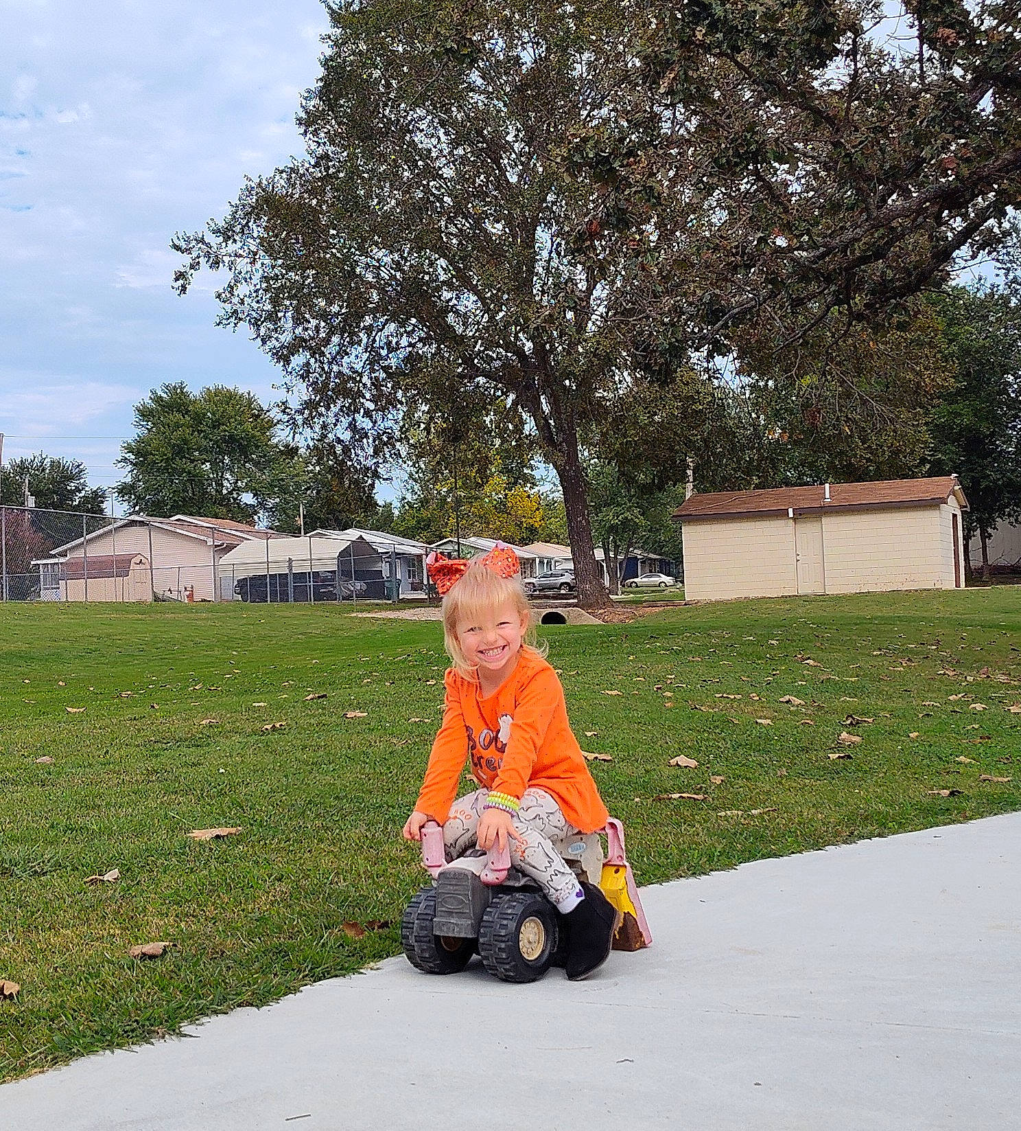 Hazelbelle joined the competition — help win amazing prizes! asphalt, automotive_wheel_system, baby, fun, grass, joy, leisure, people_in_nature, person, plant, recreation, road_surface, rolling, sitting, sky, spring, tire, toddler, travel, tree